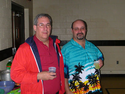 Fr. Paul and Jim next to the snack table